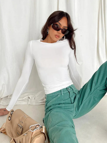 "Effortless edge meets everyday comfort. This slim-fit long sleeve tee hugs your shape without clinging — perfect for layering or owning the look solo. Designed for spring & autumn vibes with soft-stretch fabric you’ll re