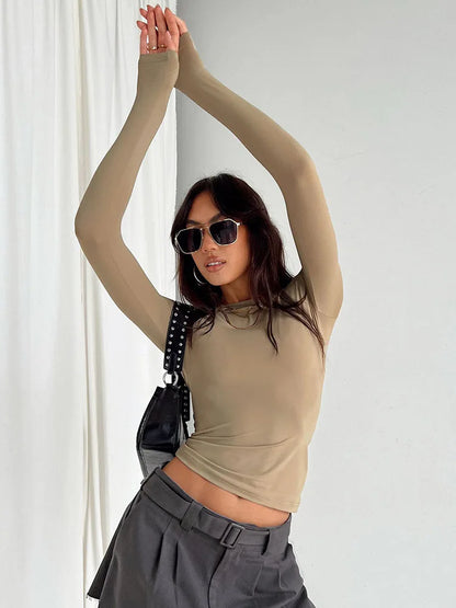 "Effortless edge meets everyday comfort. This slim-fit long sleeve tee hugs your shape without clinging — perfect for layering or owning the look solo. Designed for spring & autumn vibes with soft-stretch fabric you’ll re